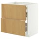 A white and light wooden kitchen cabinet with drawers and shelves.