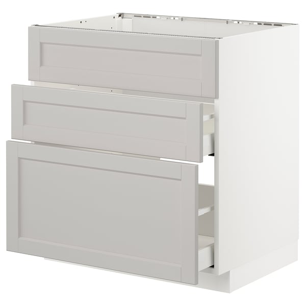 White METOD kitchen unit. Three light grey drawers, bevelled edges. Modern, minimalist design.