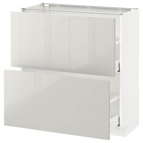 METOD high-gloss white kitchen cabinet with open drawers for storage.
