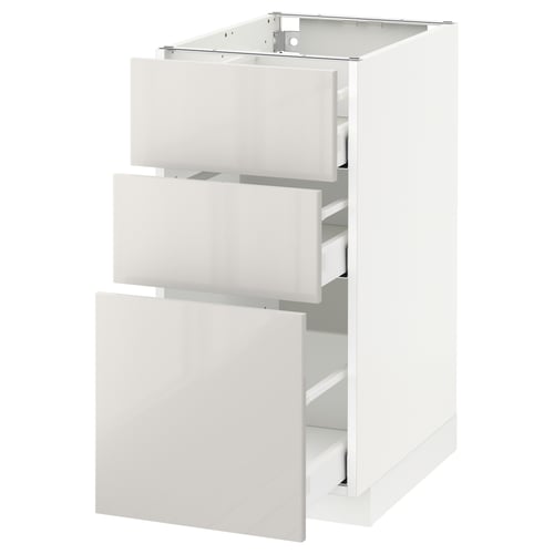 White ikea METOD kitchen cabinet with glossy drawers.