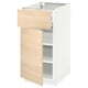 A white METOD kitchen cabinet with light ash wood drawer and door.