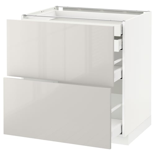 White METOD kitchen cabinet with glossy finish and drawers.