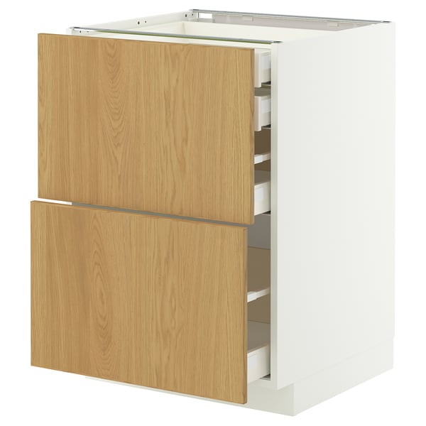 An ikea METOD white cabinet with light wood drawers, featuring a sleek modern design.