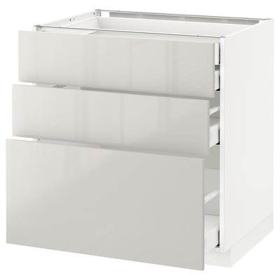 Modern white kitchen cabinet with sleek, glossy finish and smooth-running drawers.
