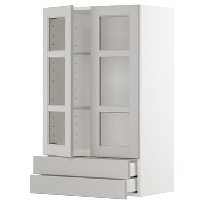 White METOD kitchen unit with glass doors, adjustable shelves, and drawers.
