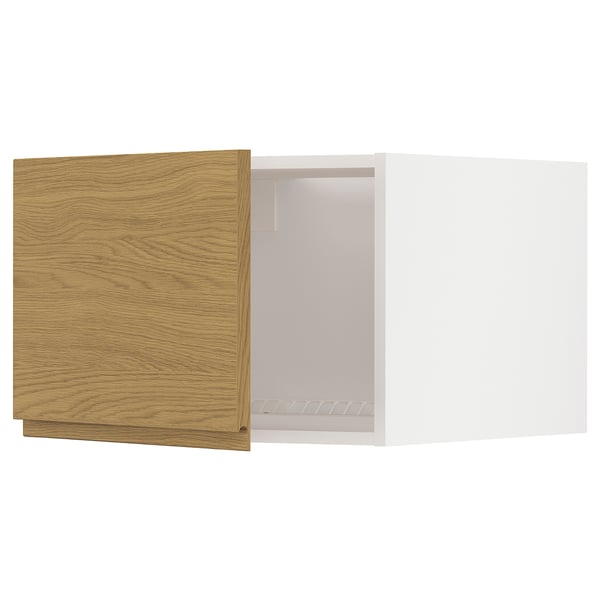 A white and wooden kitchen cabinet from the METOD system with an oak finish and sleek design.