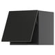 A modern black kitchen cabinet from the METOD system, showcasing a sleek, angled design with a smooth, dark finish.