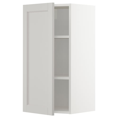 A METOD wall cabinet in white with two adjustable shelves and beveled edges.