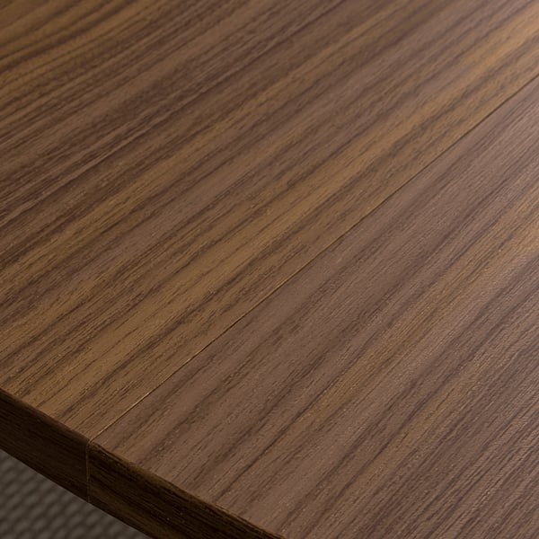 Richly stained wooden tabletop showcasing smooth, even grain patterns; beautifully crafted for a professional setting.