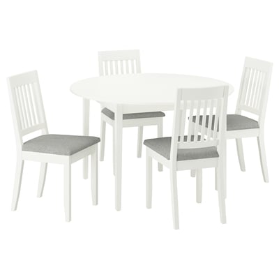 Round white dining set with 4 grey-cushioned chairs.