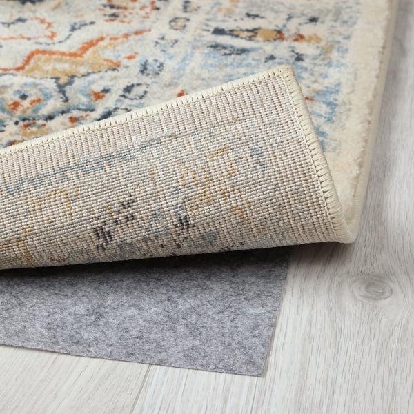 Close-up of stylish, high-quality rug with intricate patterns and sturdy backing.