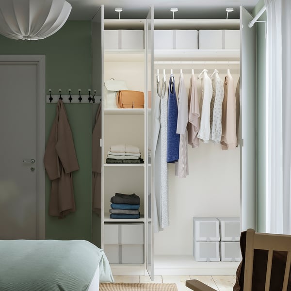 Bedroom with PAX wardrobe and mirrored door.