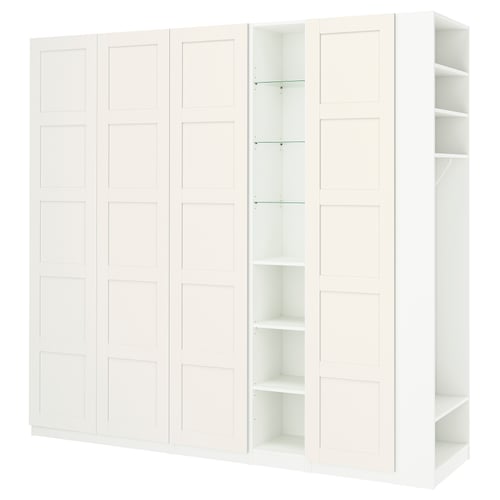 White PAX wardrobe set; closed and open sections on left, fully open shelves on right, sleek and modern design.