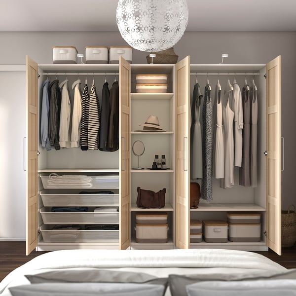 Open wardrobe with clothes, shelves, soft-close doors, lighting