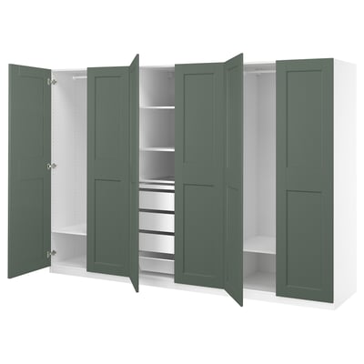 Open green PAX closet with shelves and drawers, white interior, modern design.