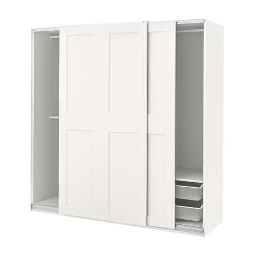 A white PAX wardrobe with sliding doors and shelves inside. Its sleek and modern, with a basic setup for easy organisation.