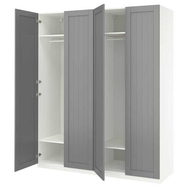 A grey IKEA PAX wardrobe with open doors, featuring shelves and a hanging rod inside.