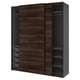 Modern PAX wardrobe in dark brown wood, sliding doors, black frame, square shape.