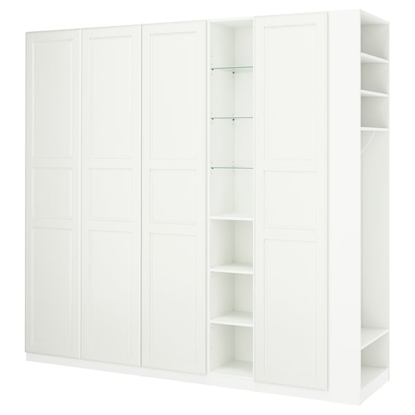 White PAX wardrobe with both closed and open storage compartments, a clean and simple design.