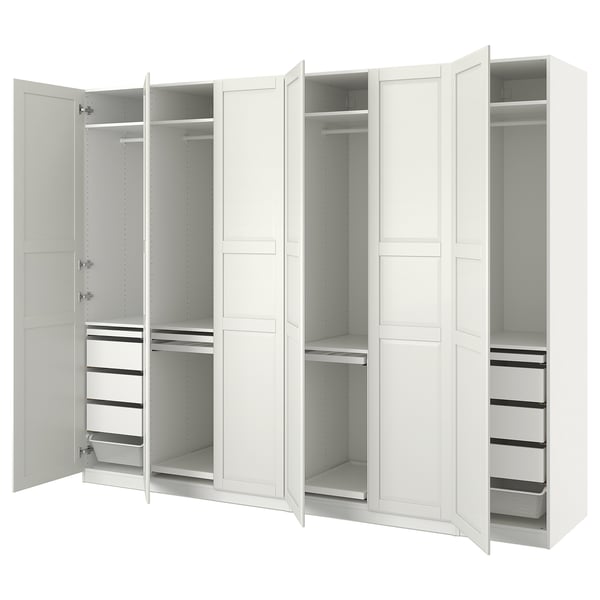 White PAX wardrobe with open doors, showing shelves and compartments. Modern design, made of engineered wood.