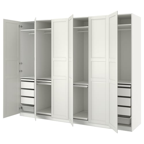 White PAX wardrobe with open doors, showing shelves and compartments. Modern design, made of engineered wood.