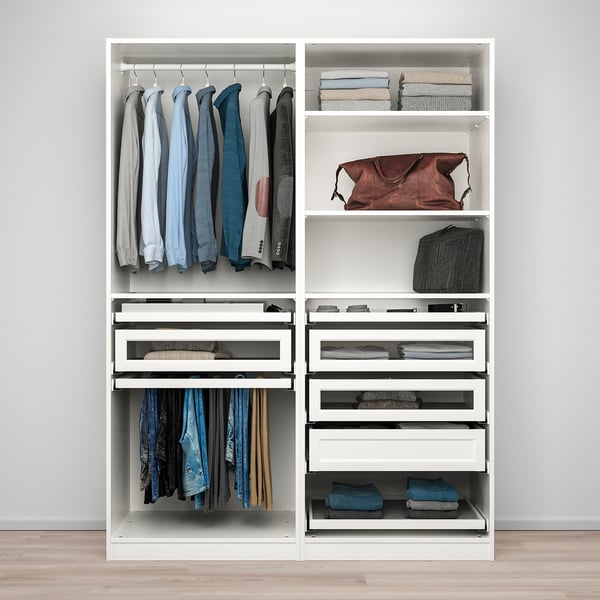 A white PAX wardrobe with hanging shirts, folded clothes, and accessories neatly organised. Adjustable feet and glass drawers for enhanced storage.