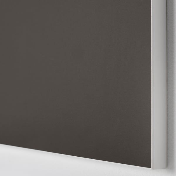 Close-up of sleek, black cabinet door made of smooth particle board with plastic edging, reflecting a modern, high-quality design.