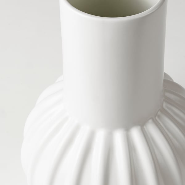 White glazed fluted vase.
