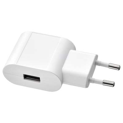 Small white usb charger, compact design, round edges.
