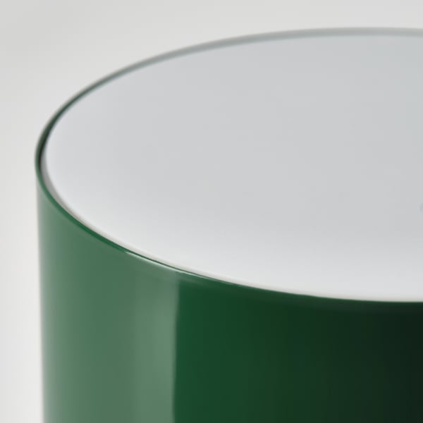 High-quality table lamps edge; sleek, white top; smooth, green base; modern design.