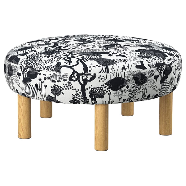 Stylish, round black-and-white patterned ottoman with wooden legs.