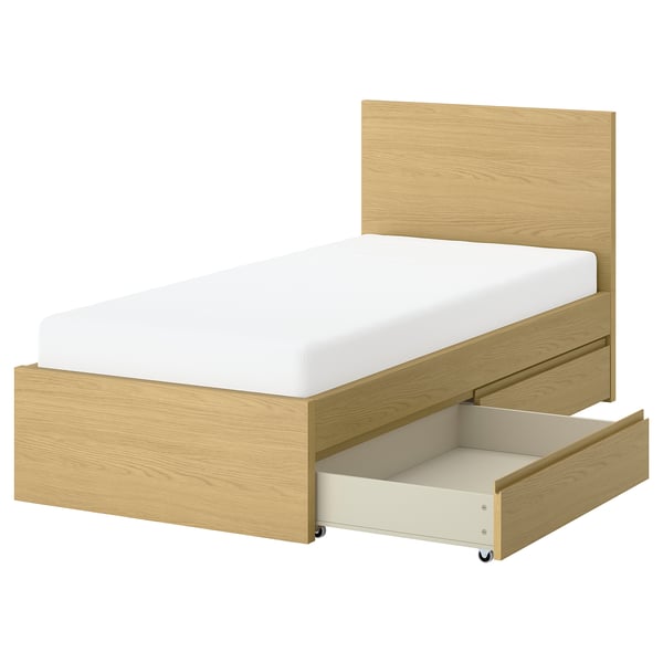 STORKLINTA bed: light wood, white mattress, simple design, underbed storage, clean lines.