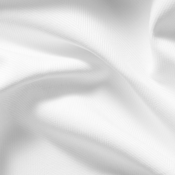 Soft, white cotton curtains with heading tape for easy installation, providing privacy and dimming daylight.