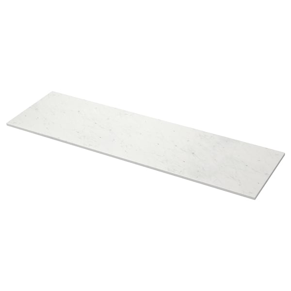 A white marble-look countertop, named TOLKEN, with a rectangular shape and sleek design, made from fibreboard with melamine and plastic foils.