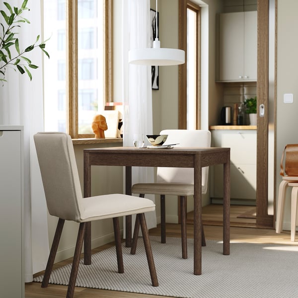 Modern dining area with extendable TONSTAD table, chairs, and pendant light. Oak theme, light colours, sunlight targeted.