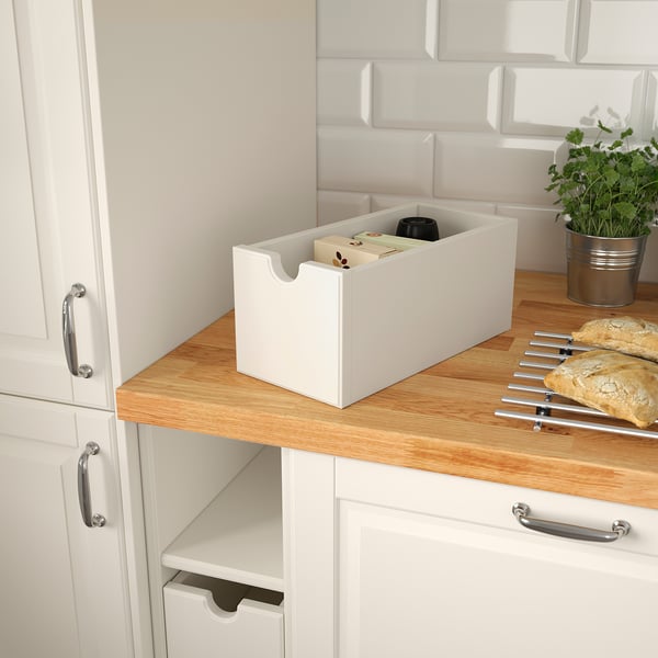 White kitchen storage box, on counter, with various items. Ideal for accessible, organised storage.