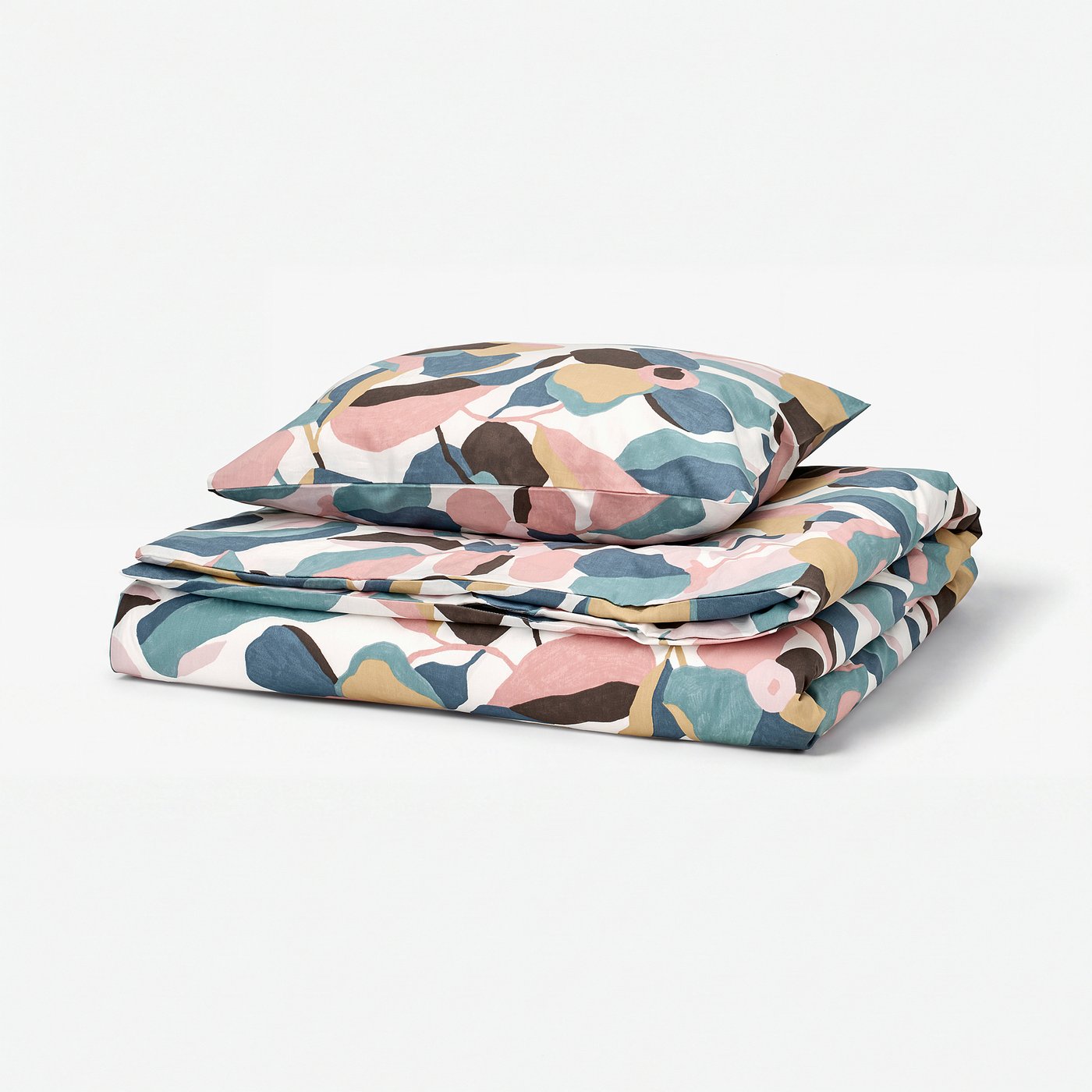Folded multicoloured leaf-pattern bedding set. Pastel shades, soft cotton/lyocell blend.