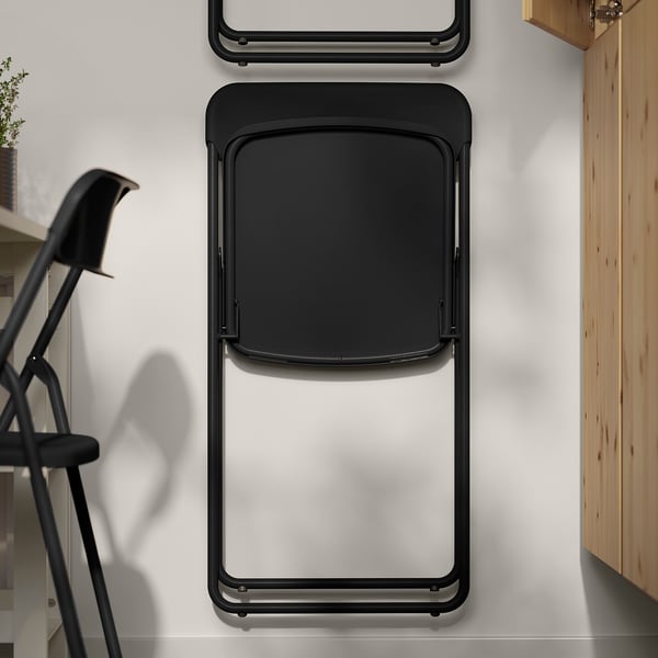 Foldable chair folds flat for space-saving storage; sturdy steel and plastic construction.