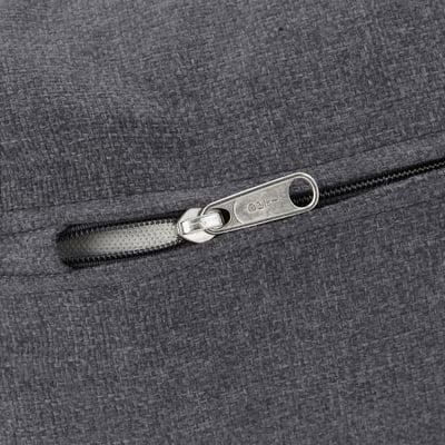 Close-up of zip on grey textured sofa, showcasing sturdy pull and sleek design.