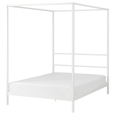 A white VITARNA four-poster bed with a metal frame. Its minimalist and modern, ideal for small spaces.