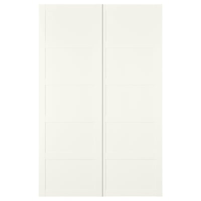 Moodsa ruudukujulise disainiga valge BERGSBO lükanduks. See on valmistatud puitkiudplaadist ja sellel on klanitud ja minimalistlik välimus.
