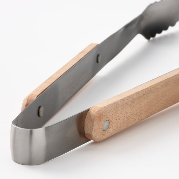 Roostevabast terasest tangid puidust käepidemetega, kvaliteetne grilltööriist.