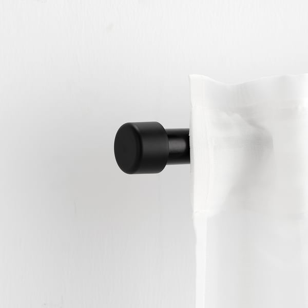 HELTUSS detailid mustas, minimalistlikus disainis. Väiksem kui rusikas, sobib kodukaunistuseks kardinavardaga.
