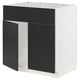Kaasaegne mustade uste ja valge raamiga köögiseade.