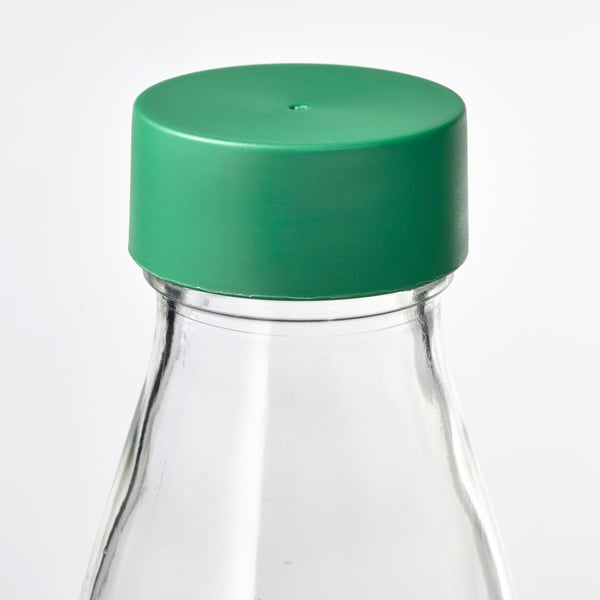Rohelise plastkaanega läbipaistev klaaspudel, suletav ja sobib erinevate jookide jaoks.