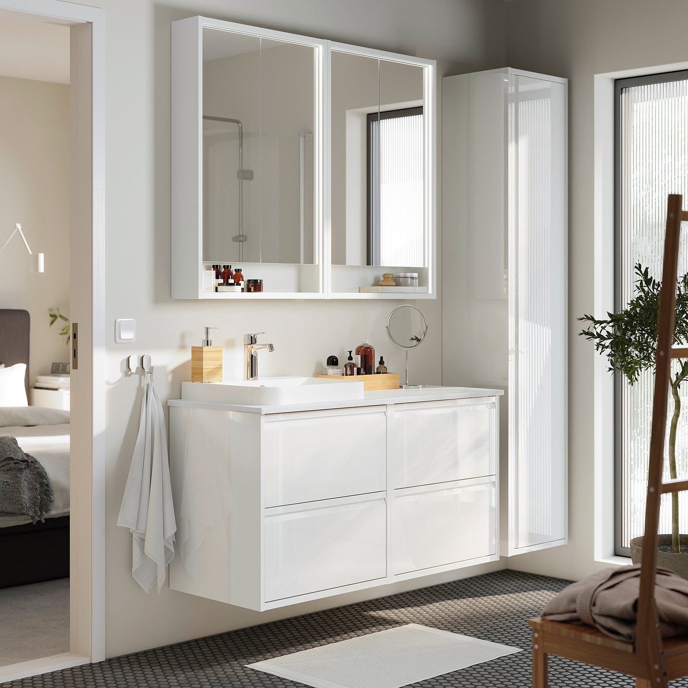 Modern white bathroom with ängsjö vanities and marble basins.