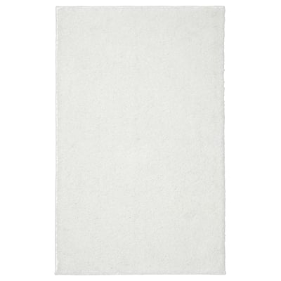 BACKMÅRA bath mat, white. Soft, recycled polyester with latex backing, rectangular, plain.
