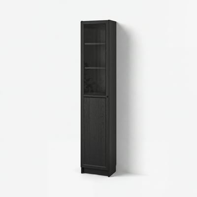 BILLY black bookcase with glass door on white wall.