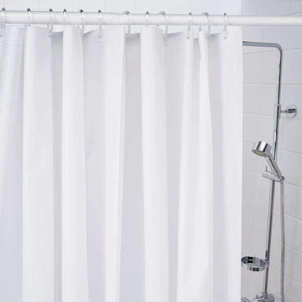 Chrome hooks hold water-resistant shower curtain.