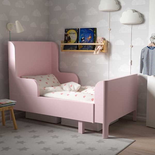 Pink kids bed, rounded design, soft pillow, durable, fits cloud room.